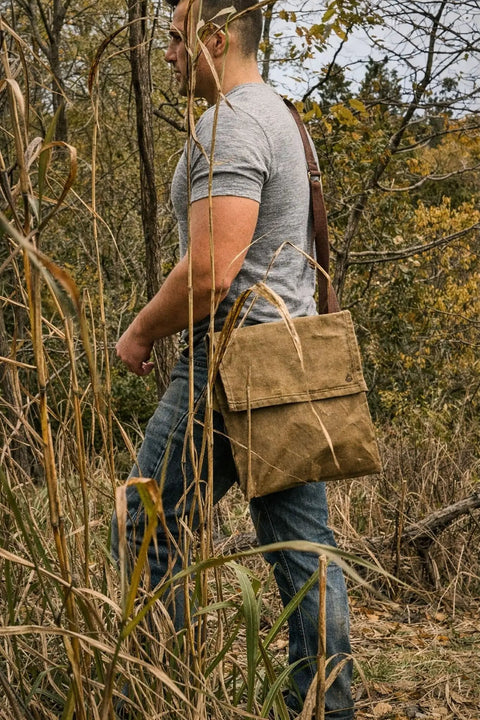 Person hiking with Waxed Canvas Haversack With Adjustable Strap for Outdoor Adventures 11 by 14 Inches Fits From Small to 5XL