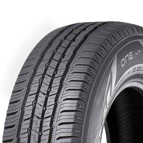 Road Ready LT245/75R16 Highway Terrain Tire Loaded For Heavy Duty Light Trucks With All Season Grip close-up view of tread pattern.