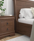 Bedroom scene with bedside table featuring Provence Collection Matte Black Iron Ring Pull For Cabinets And Drawers installed.
