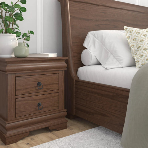 Bedroom scene with bedside table featuring Provence Collection Matte Black Iron Ring Pull For Cabinets And Drawers installed.