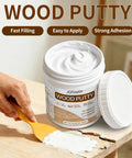 Premium White Wood Filler For Furniture Repair Heavy Duty Blend applied to wood surface with a spatula in a 10.58 oz tub.