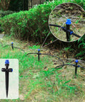 Adjustable 360 Degree Drip Irrigation Emitters installed in garden, for Quarter Inch Tubing, with close-up of water spraying