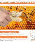 Hand using queen catcher clip from Beekeeping Starter Kit 11 Piece Queen Bee Marking Set on honeycomb.