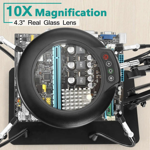 Helping Hands Soldering Station With 10X Magnifying Glass And LED Light Four Magnetic PCB Holder Arms on electronic board.