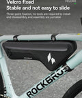 Bike with Waterproof Bike Frame Bag With Seamless One Piece Construction Front Bag With Four Sided PP Reinforcement attached.