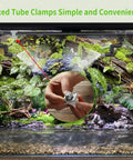 Misting Irrigation Kit For Plants With One Quarter Inch And One Half Inch Tubing, showing fixed tube clamps in greenhouse setup.