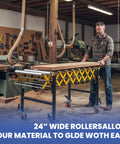 Huge 1000 Lb Capacity Adjustable Conveyor Roller with Wheels, 24" wide, in a woodworking shop for easy material handling.