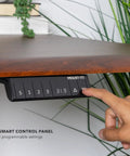 Pro Grade 60 Inch Electric Standing Desk With Adjustable Height And Memory Presets, smart control panel in use.