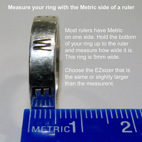 A silver ring resting on a blue metric ruler, demonstrating measurement for EZsizer selection, with text instructions visible.