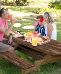 Family enjoying lunch on picnic table with Waterproof Picnic Table Cover Set With Bench Covers Elastic Edges Brown Wood Fitted Tablecloths