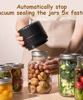 Person using Electric Mason Jar Vacuum Sealer Kit Game Changing With Ten Lids Included Automatic Seal For Fresh Pantry Staples Perfect For Salads Canned Goods Pickles Fermented Foods And Preserves on jar of nuts