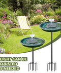 Solar Powered Bird Bath Fountain With Lotus Flower Nozzle And Five Prong Stake Base in garden setting