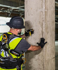 Worker installing A5 Concrete Expansion Anchor 5,000 Lbs Mbs Reusable Steel for Heavy Duty Anchoring on concrete pillar.