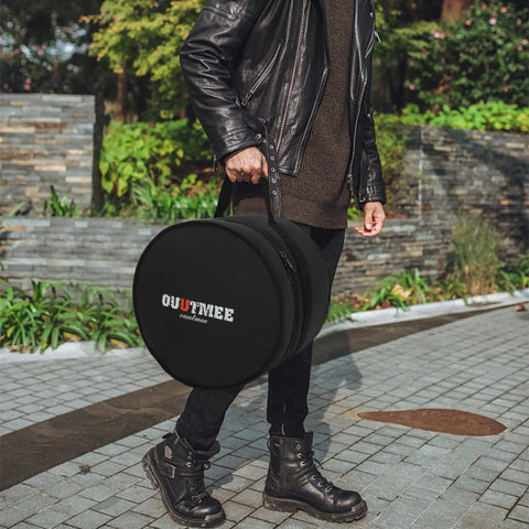 Pro Level Five Piece Drum Bag Set With Sick 10 Mm Shock Absorbing Padding, durable black case carried by a person.