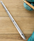 Heavy Duty Stainless Steel Rub Rail For Yacht Hull Protection And Dock Edge Guard on wooden surface with yarn.