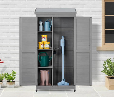 Outdoor Cedar Wood Storage Shed With Metal Top Built To Last Tall Vertical Tool Cabinet For Backyard Garden Patio And Lawn Weather Resistant 68 By 33 By 20 Inches Large Capacity For Tools And Gear Grey showing open doors with shelves, boots, and watering can in a garden setting.