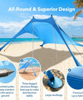Ultra Portable Beach Tent Canopy With UPF50 Sun Protection on sandy beach with poles and sandbags, fits 4-5 adults