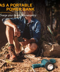 Person charging phone using Beefy Rechargeable Handheld Spotlight One Million Lumens LED Light as power bank outdoors.