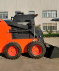 Side view of a compact tracked skid steer loader with heavy-duty rubber tracks for all terrain work in construction and landscaping.