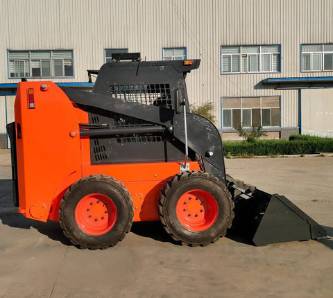 Side view of a compact tracked skid steer loader with heavy-duty rubber tracks for all terrain work in construction and landscaping.