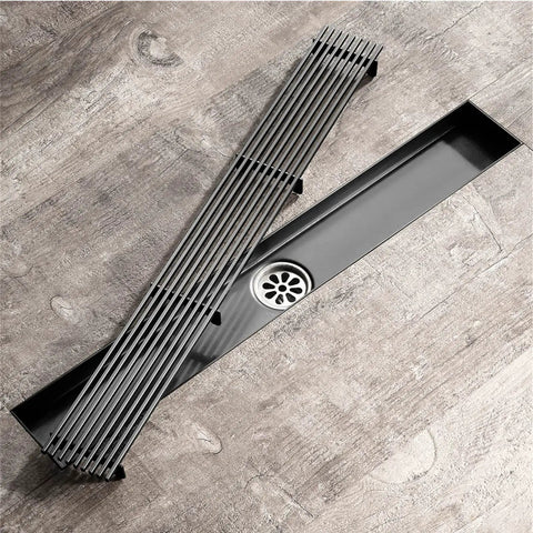Sleek Linear Shower Drain In Heavy Duty Stainless Steel With Removable Grate And Hair Catcher For Hassle Free Bathroom Drains Finished In Slick Rose Gold, viewed from above.