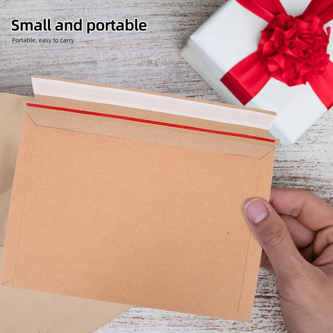 Person holding A4 Self Sealing Kraft Brown Envelopes Pack Of 30 Thickened Flat Cardboard Mailers