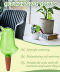 4 Pack Self Watering Spikes For Indoor Plants Bird Shape Automatic Irrigation Globes on table with potted plant