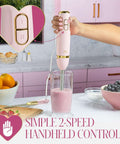 Chic Pink And Gold 3 In 1 Immersion Blender With Whisk And Chopping Bowl 400W High Speed Handheld Mixer in use blending smoothies.