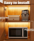 Set Of Two White Push To Open Magnetic Cabinet Door Latches installed inside wooden cupboard with microwave and coffee machine