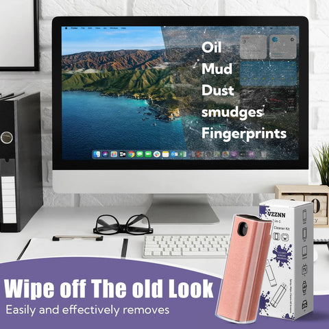 Pink 3-in-1 screen cleaner kit with built-in spray bottle and box on a desk beside an iMac