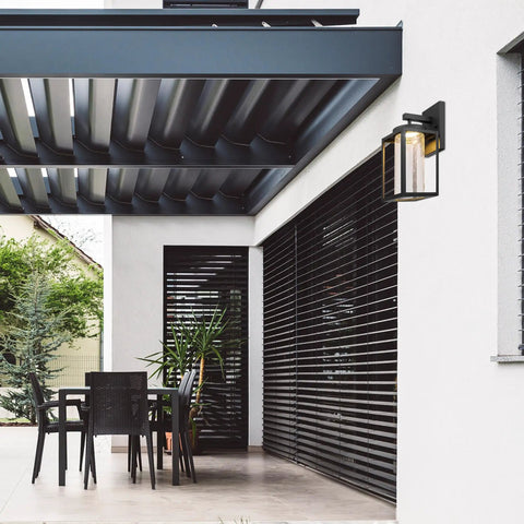 Modern porch with Capulet Amber Glass Center Column Outdoor Indoor Wall Sconce With LED Black Finish, minimalist design.