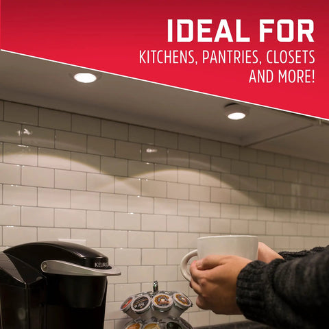 LED Puck Lights 2 Pack Battery Operated Tap Light Wireless Stick On Under Cabinet Closet Pantry Lighting 50 Lumens No Wiring Needed Easy Install Perfect For Cabinets Closets And Pantries In Every Room installed under a kitchen cabinet, illuminating a countertop.