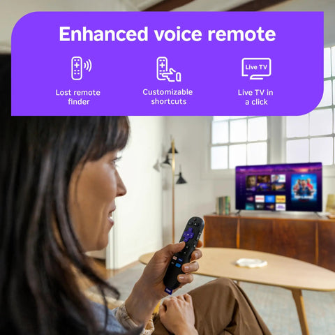 User holding an enhanced voice remote for the 55 Inch QLED Smart TV with Sharp 4K Resolution And Rich HDR10 Colors.