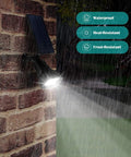 Solar Outdoor Lights 2 Pack With 6 LED Waterproof Spotlight No Fuss Auto On Off 200 Lumen on brick wall in rain