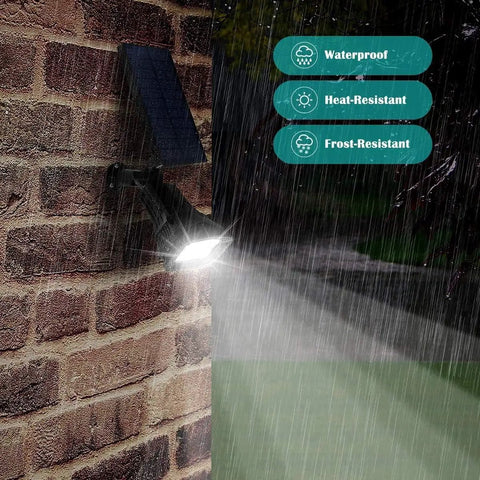 Solar Outdoor Lights 2 Pack With 6 LED Waterproof Spotlight No Fuss Auto On Off 200 Lumen on brick wall in rain