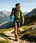 Person hiking with Foldable Hydration Bottle For Hiking And Running, 11.42 Inch Squeeze Bladder With Leakproof Caps