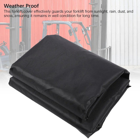 Rid Your Rig From Rain And Dirt With This Straight Up Tough Six Hundred Denier Forklift Cover Featuring Universal Fit And Reflective Strips For Total Job Site Peace Of Mind, black folded cover made of 600D material.