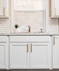 White kitchen cabinets with Solid Core Stainless Steel Cabinet Pulls 5-1/16 Inch Center, modern handles