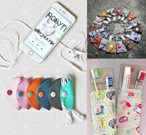 Colorful earphone organizers, toothbrush holders, and keychain pouches displayed with a smartphone and headphones.