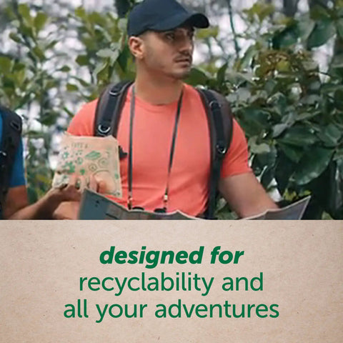 Man holding Earth Friendly Paper Sandwich And Snack Bags Pack Of 50 Recyclable Non Wax Paper in outdoor setting.