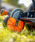 Close-up of Old School 18 Inch Manual Reel Mower With 7 Blade Ball Bearing Reel showing adjustable cutting height mechanism and wheel