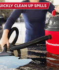 Pro Grade 2.5 Gallon Wet Dry Shop Vac Featuring Wall Mount Storage And Killer Suction Motor For Rapid Garage Sweeps Durable Carry Handle Design In Fiery Red used to clean spills on a granite countertop.