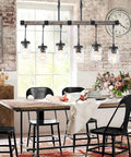 Dining room with Boss Gold Farmhouse Chandelier With Six Lights, modern industrial style, over rustic wooden table.