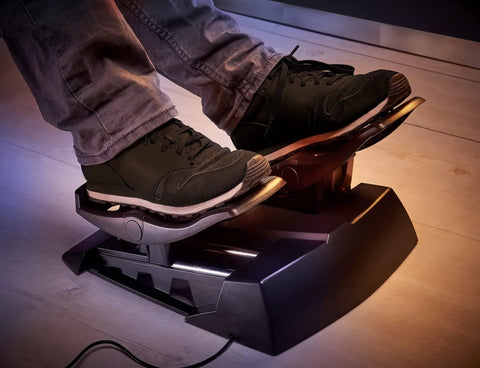 Precision Flight Sim Rudder Pedals for PS5, Xbox, and PC with long travel axis in use, showing foot control angle.