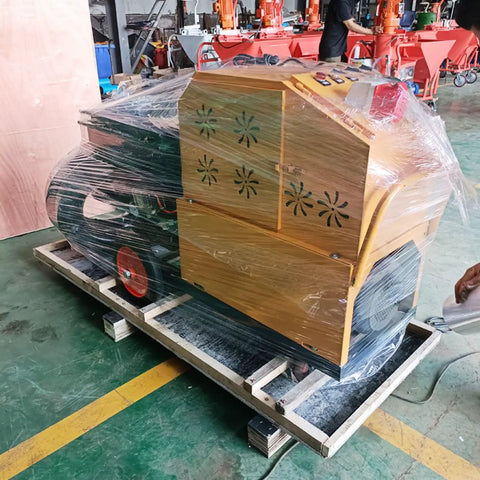 Heavy Duty Construction Wall Render Spraying Machine wrapped in plastic on a wooden pallet, ready for shipping.