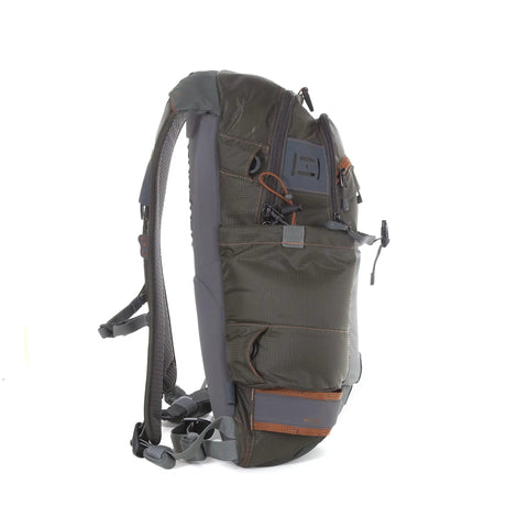 Side view of Ridgeline Fly Fishing Backpack For Real Anglers, showcasing hydration pass-through, foam shoulders, and top pockets.