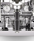 Close-up view of Top Tier Chrome Espresso Machine Cranking Out Perfection With A Rotary Pump Heat Exchanger And PID Temp Control.