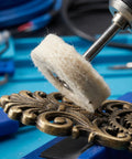 Whip Your Stainless Steel Kitchen Sink Or Metal Hardware Into Shape With This Hella Flexible Mini Polishing Brush Set on ornate metal gear.