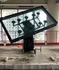 Beast Mode Glass Installation Cart Built With Heavy Duty Steel Frame And Pivoting Locking Wheels for moving large glass panel at construction site.