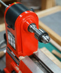 Heavy Duty Drill Chuck Set 5/8 Inch Capacity With JT33 MT2 And JT33 MT1 Taper Arbors attached to red lathe machine